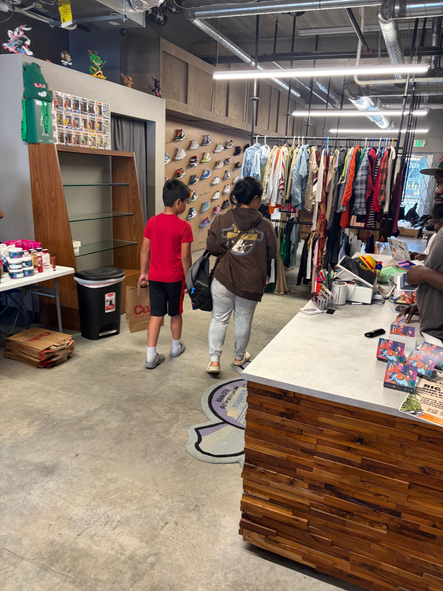 Youth selecting shoes from a display wall at the Fresh and Fly Back-to-School Bash