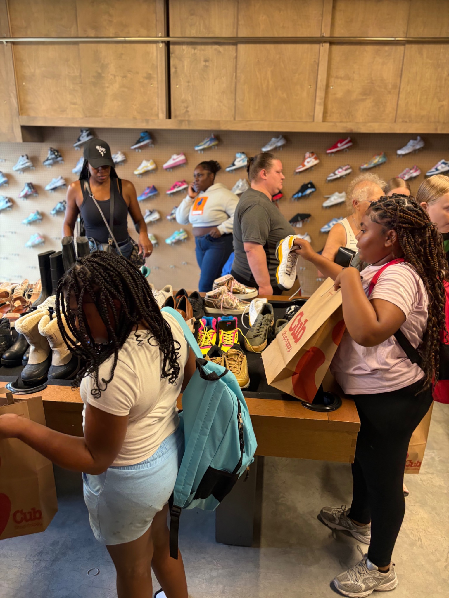 Community members and volunteers at the Fresh and Fly Bash indoor event space